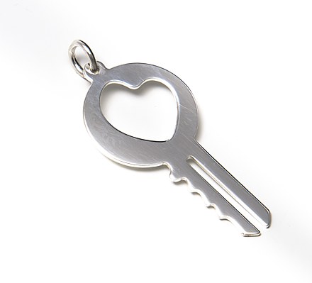 Key shaped silver pendant